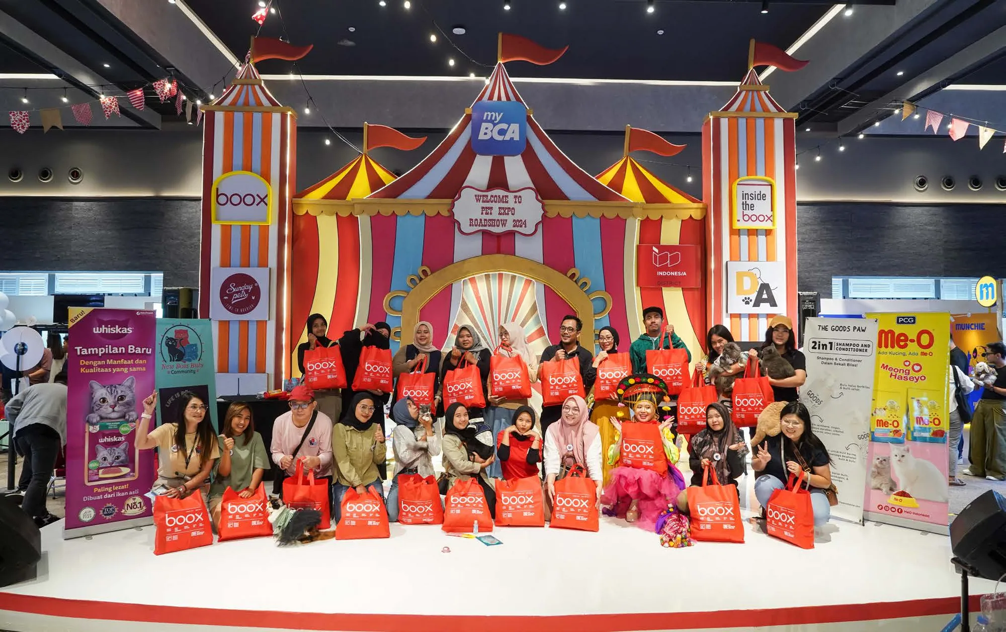 Circus-tent installation at Pet Expo Roadshow 2024 carrying BOOX and myBCA branding, with visitors lined up holding BOOX tote bags