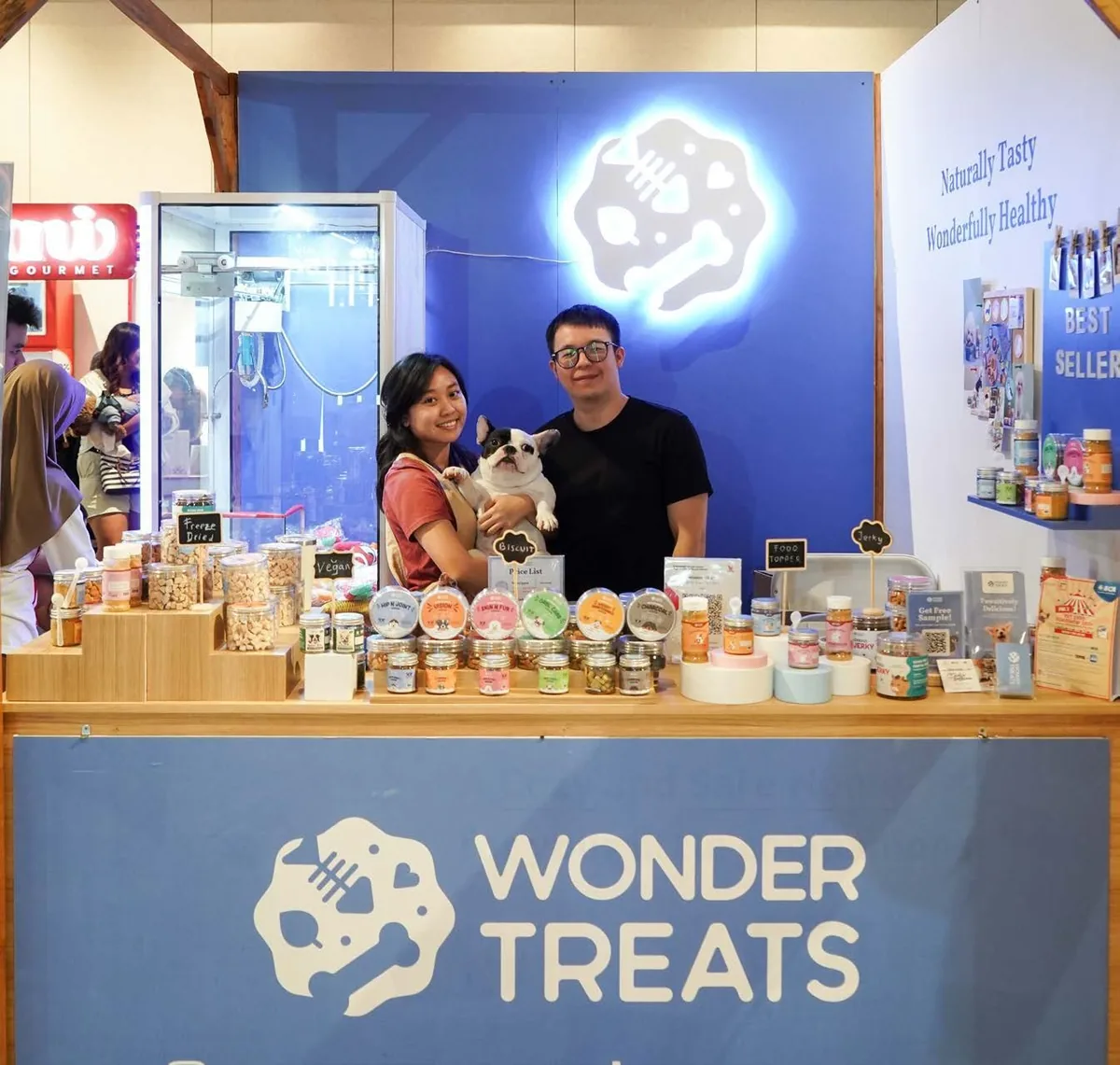 Staff and visitors at the Wonder Treats booth inside the expo
