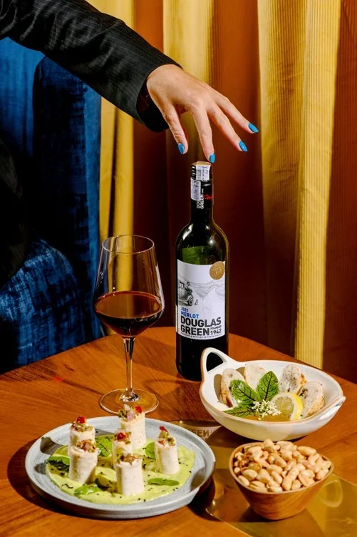 A dish and wine bottle in commercial photography