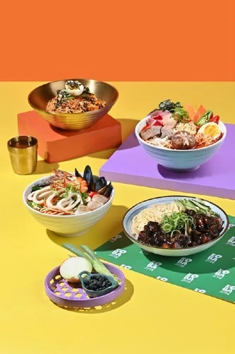A Koba spread in orange and yellow art direction