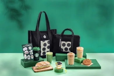 Starbucks drinks and food styled on a green set for a seasonal campaign